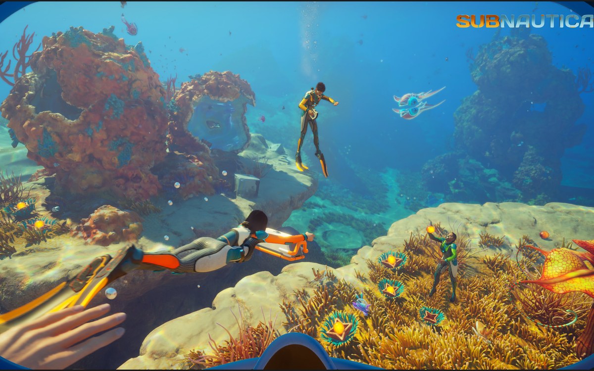 Subnautica 2 bright coral biome scene with divers exploring together.